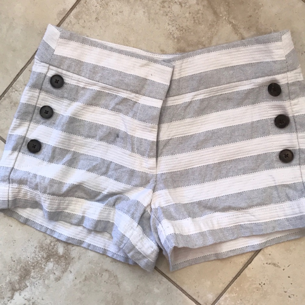 Textured shorts with buttons in the front.